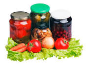 Jars of food and various vegetables