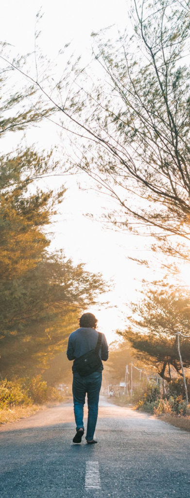 Person walking down a road